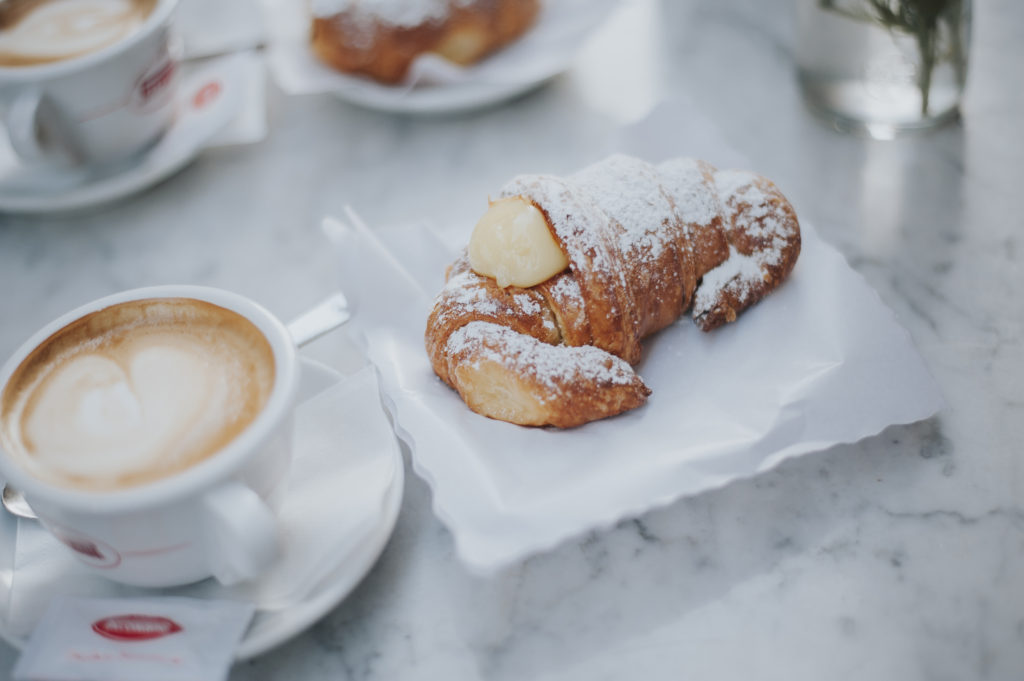Italian croissant and cappuccino