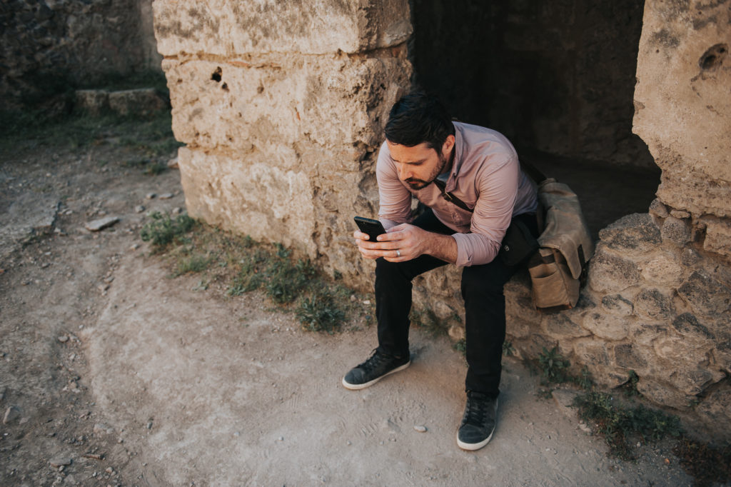 Pompeii - Soner on his phone